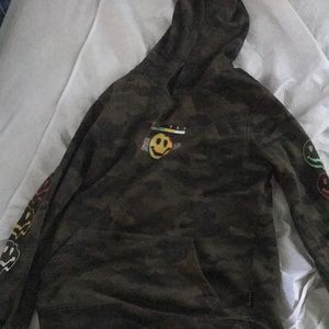 I am selling a smiley face camouflage hoodie